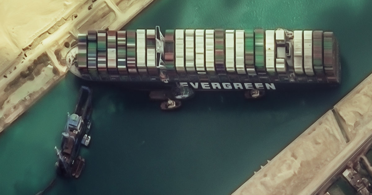 In this image we can see the famous Evergreen lines vessel, Ever Given, stuck in the Suez Canal in Egypt in the year 2021.