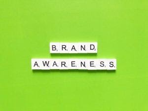 Brand awareness spelled with scrabble letters.