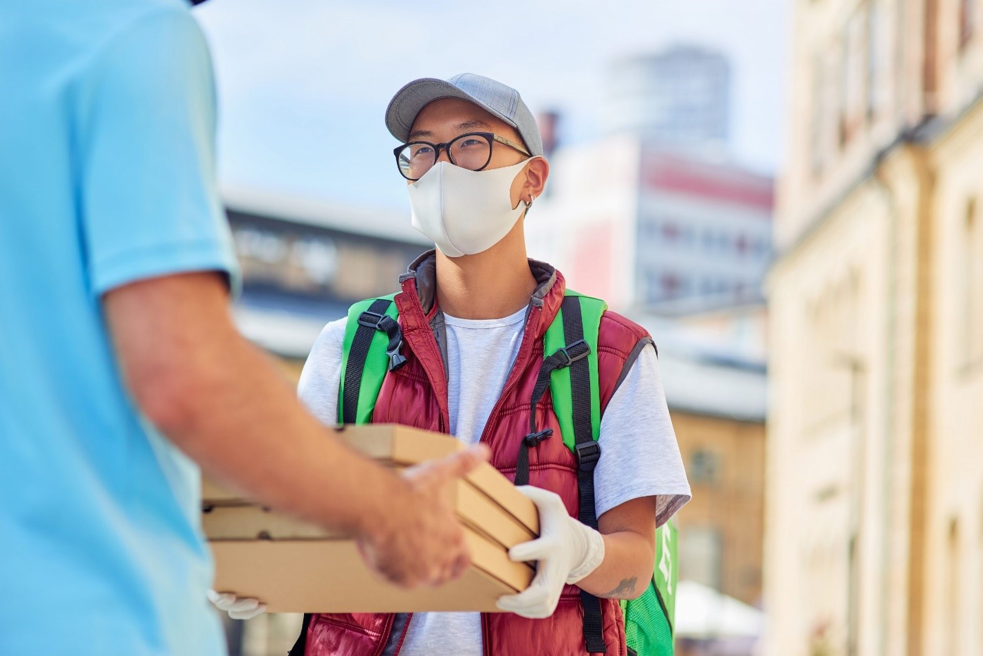 A young person delivering a package.