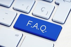 F.A.Q written on a blue key.