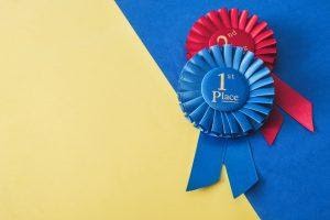 Ribbons for first and second place, showing achievements as one of the methods of gamification in apps.