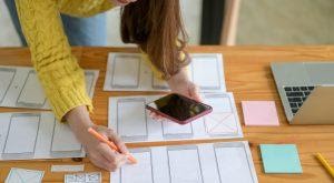 A girl working on mobile app onboarding.