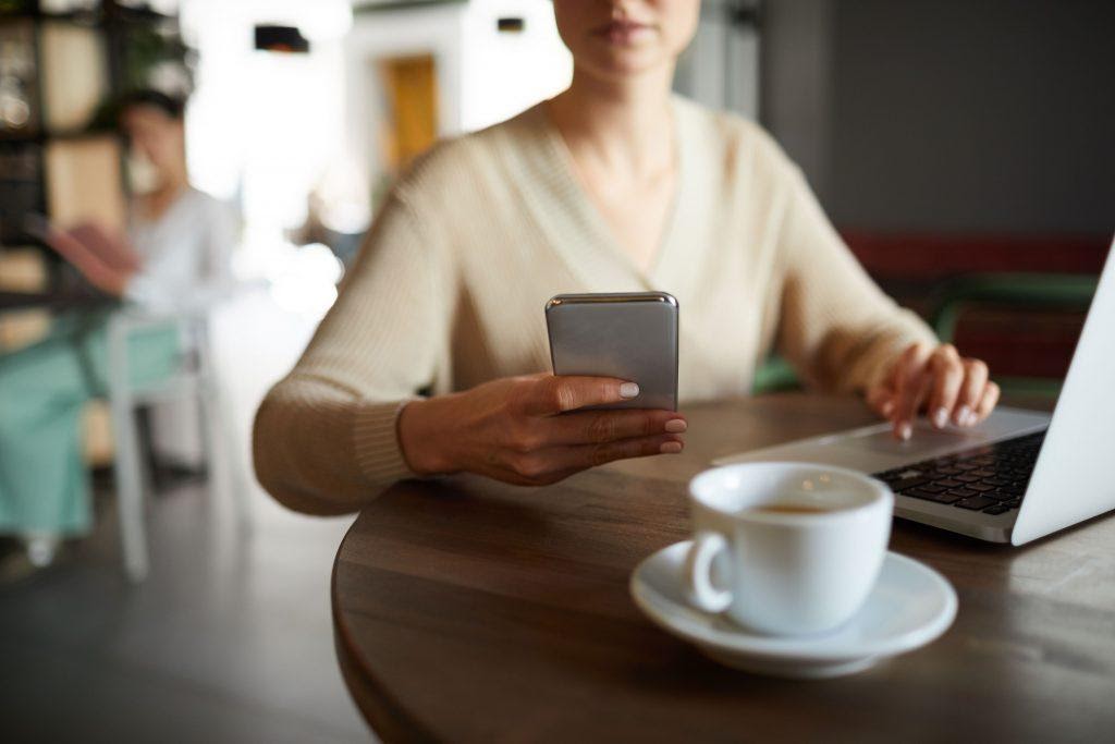A person going through their social media on their phone, showing one of the reasons why web stories are so engaging