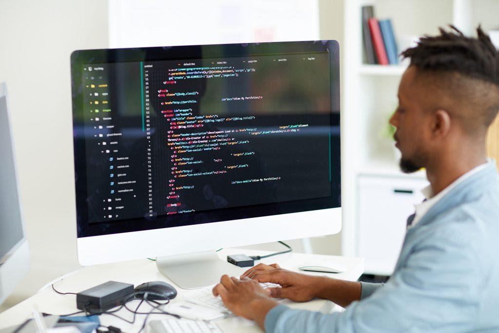 A web developer working on a computer.