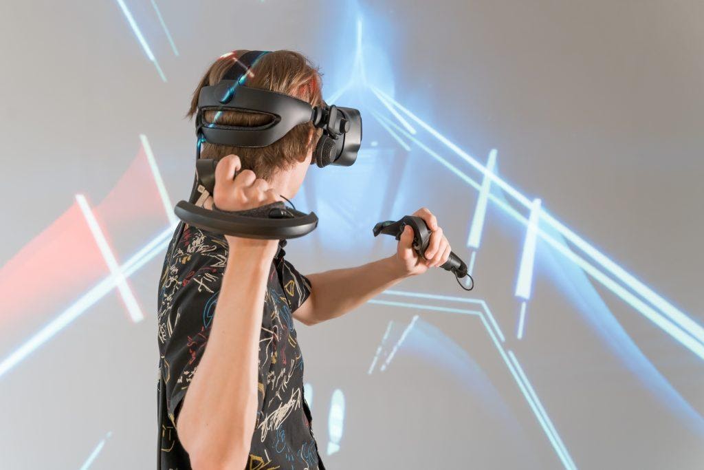 A person enjoying a VR game, showing the potential of VR marketing.