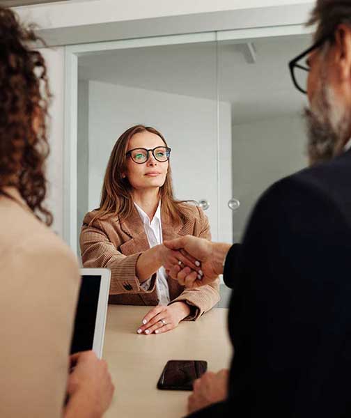 female client shaking hands with accountant