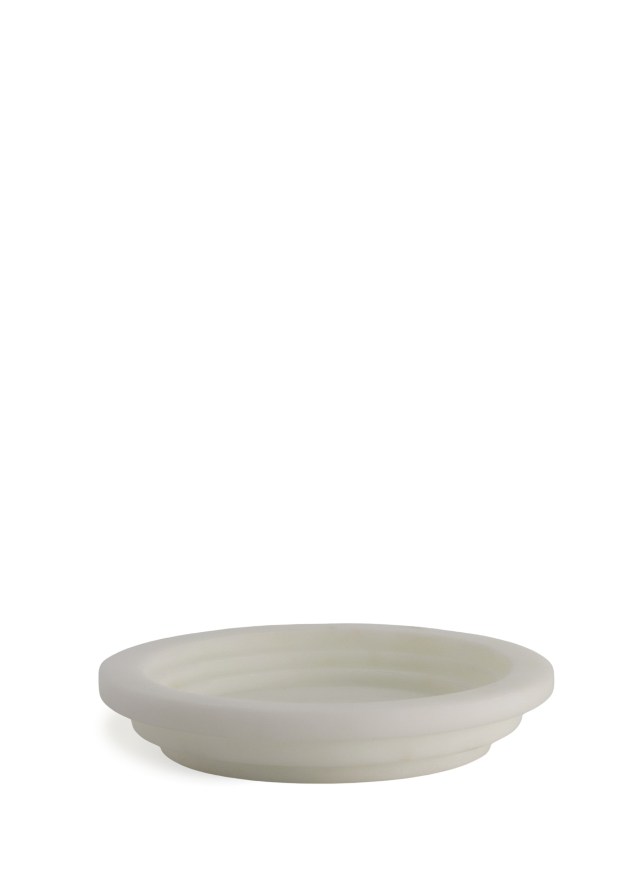 This timeless ashtray created by Tuscan sculptor, Michele Chiossi, blends contemporary design with mythological and symbolic poetry. The Guggenheim Round Ashtray by MMairo is a still-life object to liven any living room surface. Craved out of local Bianco Michelangelo marble, the circular shape mirrors the natural movement of a smoke circle when diffusing in the air. Every piece is unique and artisanally carved in Italy.