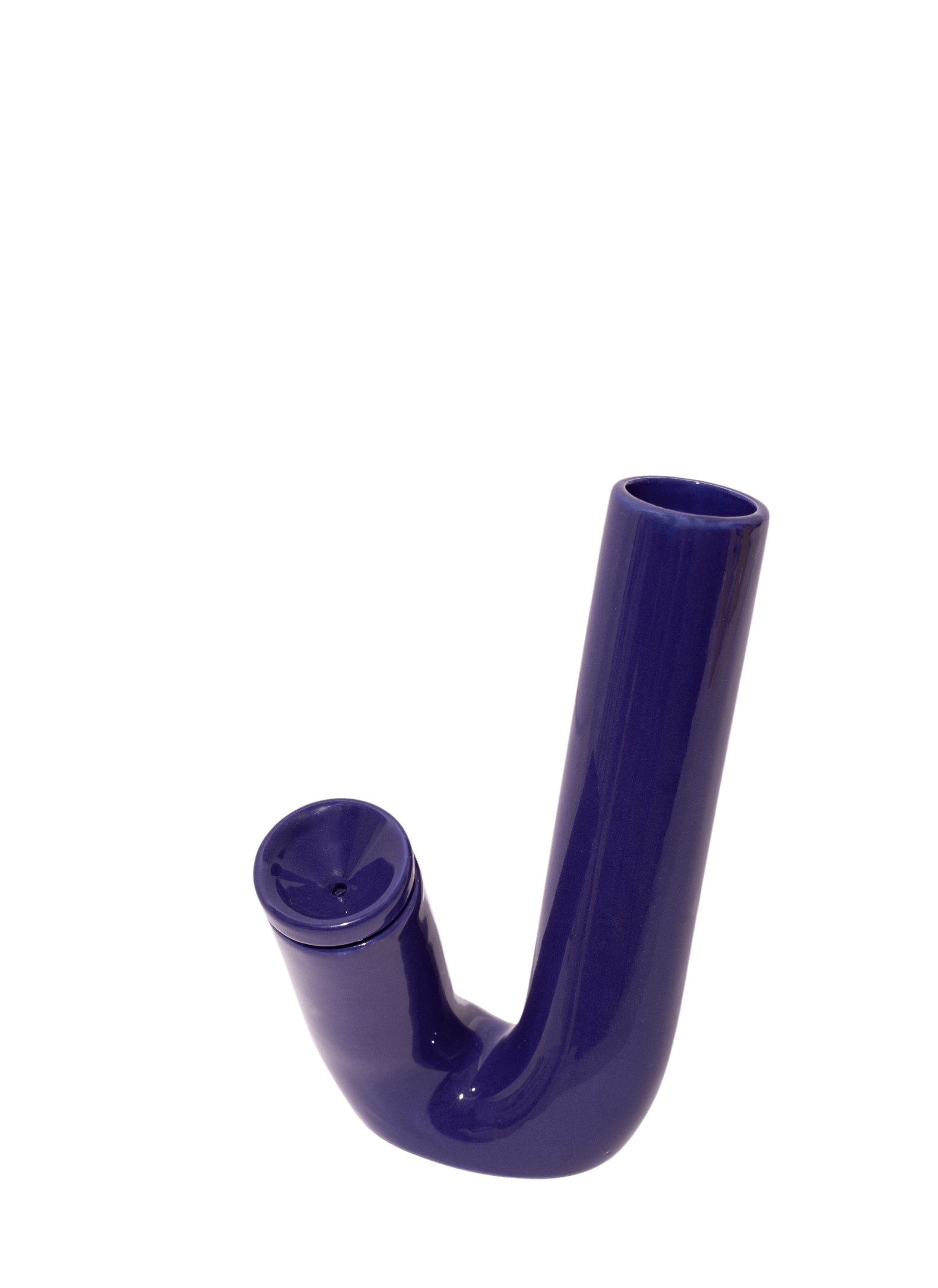 The SB001 bong by Weed'd is an Italian masterpiece by designer Valerio Sommella. Revisiting the physical representation of the bong, a pipe, and bent tube becomes a communicating vessel. The VS001 water pipe is available in 3 saturated colors in glazed ceramic. This bong is handmade in Milan using artisanal practices. The Weed'd water pipes are limited releases with only 50 per color in the world.