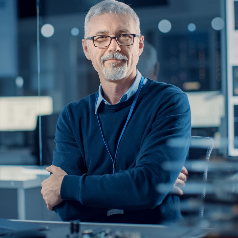 Imaging device manufacturer a well dressed man in glasses.