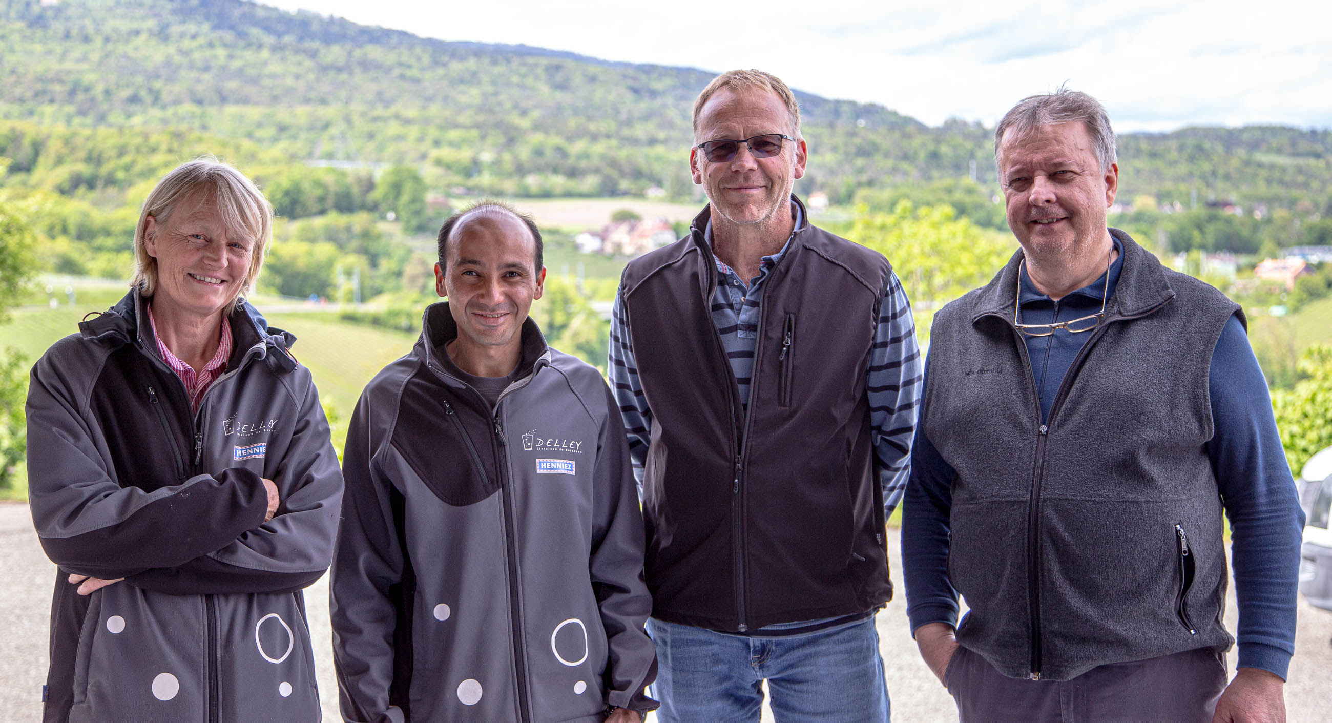 Une photo des quatre collaborateurs de Delley Boissons Sàrl