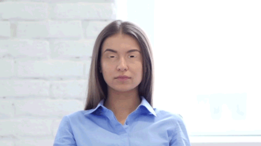 Image of a woman looking toward the camera, with slightly digital eyes.