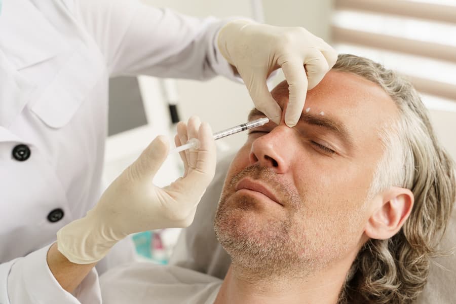 Man receiving botox injection