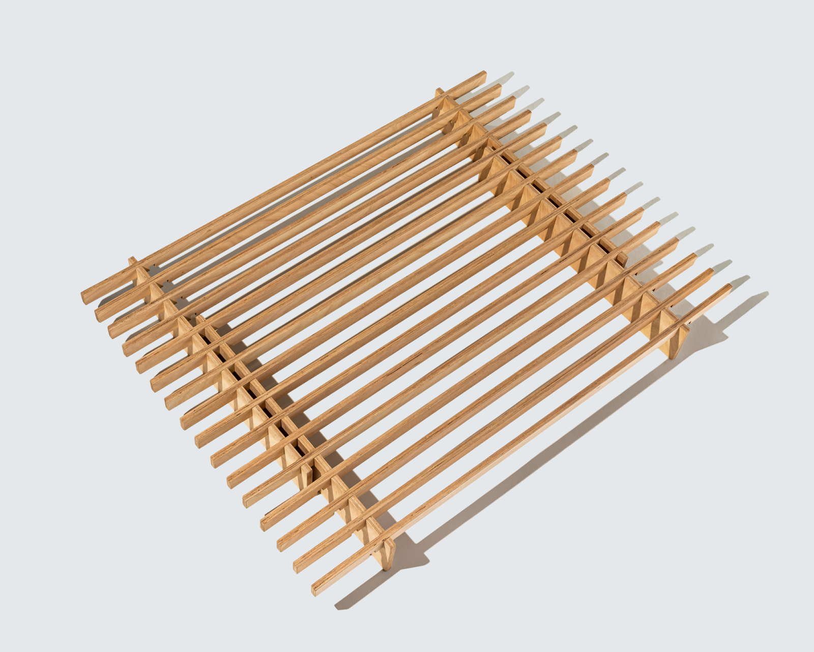 Quagga's No Fuss Plus wood bed frame on a white surface.