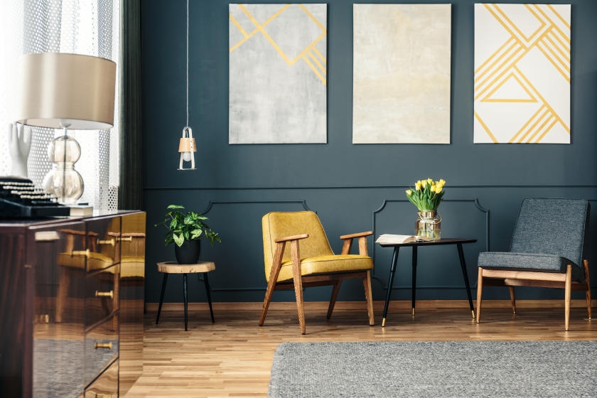 Dark green living room with yellow and gold accents