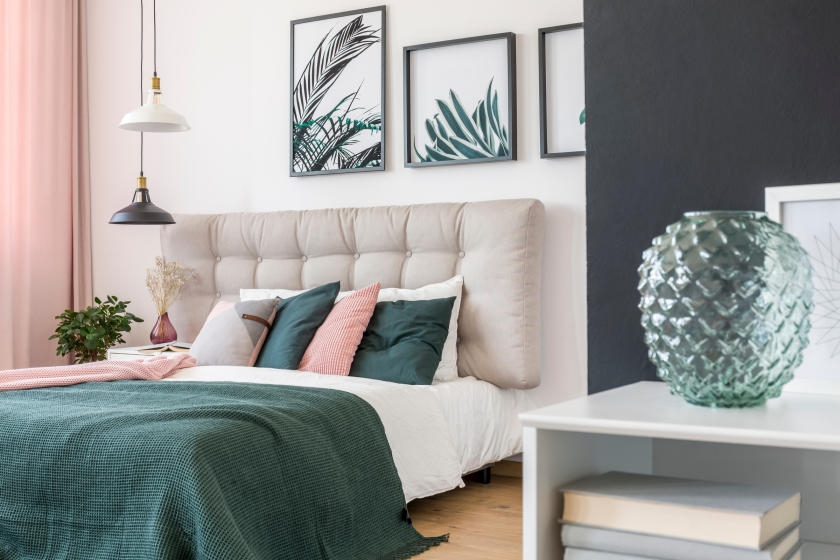 Blue and white bedroom with green and pink decor