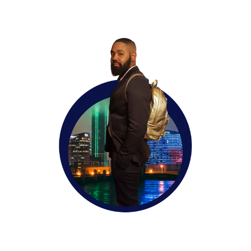 Owner of market's target LaCedric Castleberry standing hands in pocket and a gold back on in front of Dallas skyline