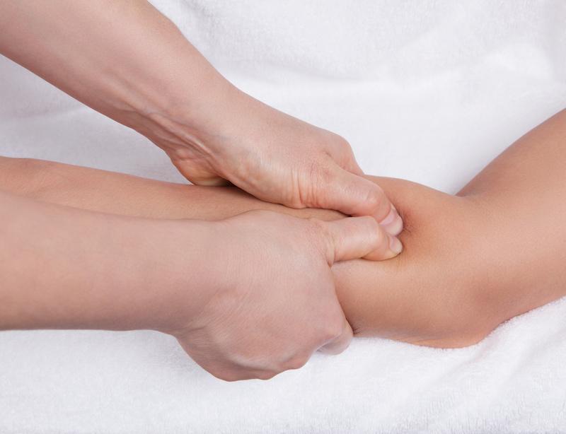 physiotherapist chiropractor massaging forearm for carpal tunnel syndrome