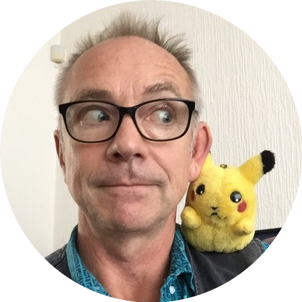 Headshot of Les Bubb with a Pikachu doll