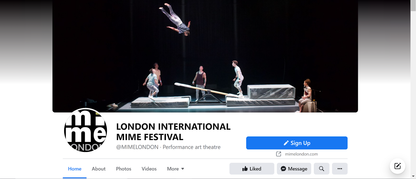 Screenshot of London International Mime Festival Facebook group with image of people performing onstage, with acrobatics and one person in the air
