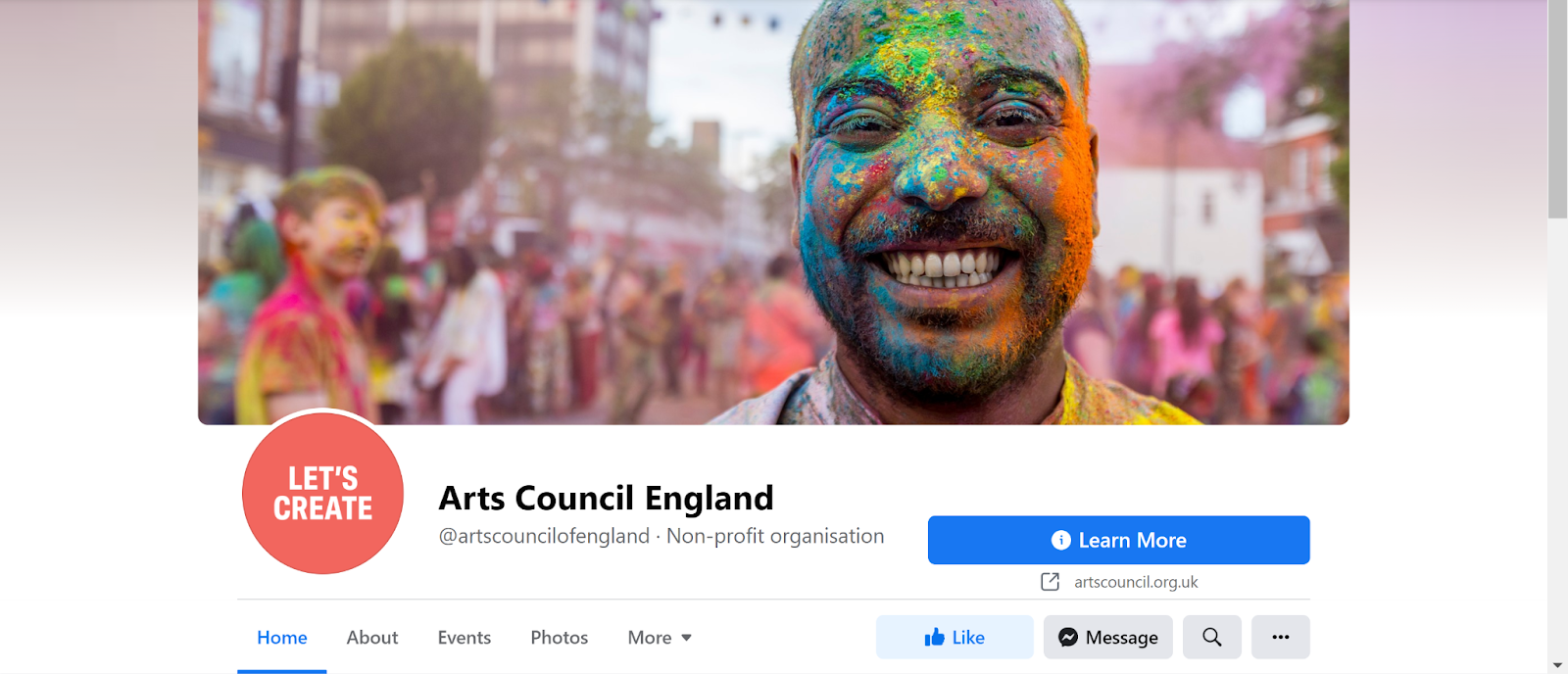 Screenshot of Arts Council England Facebook page with photo of man in powder paint