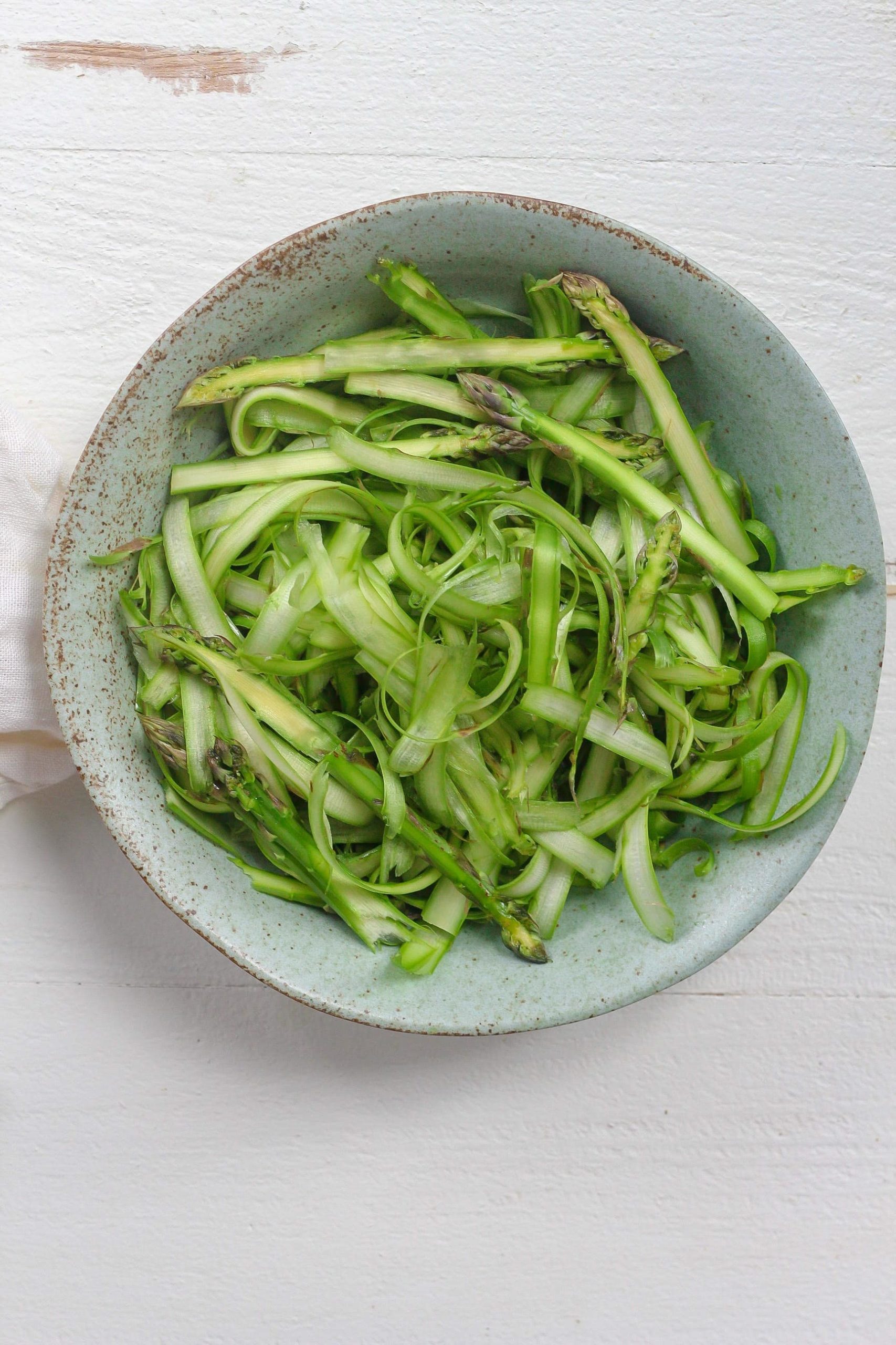shaved asparagus in bowl 