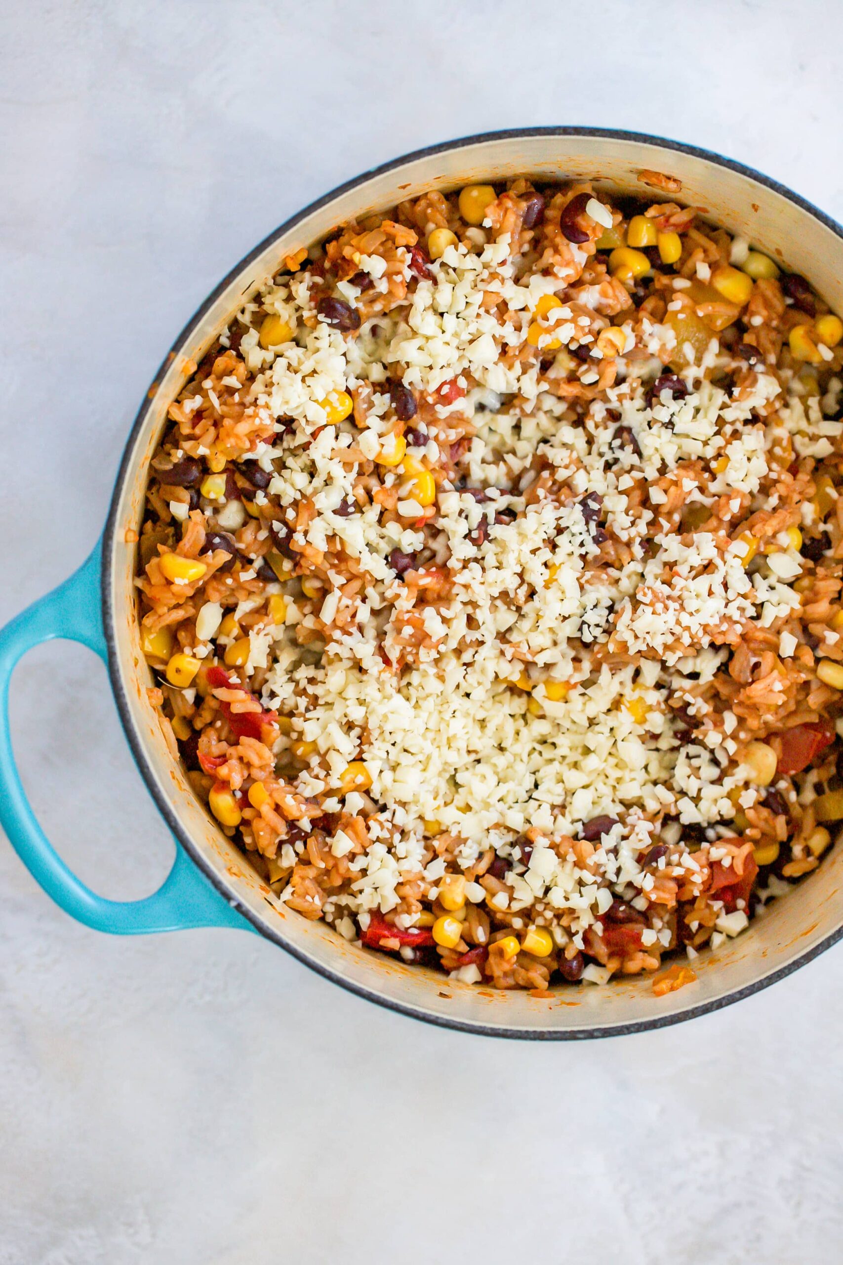 rice and beans with cheese on top