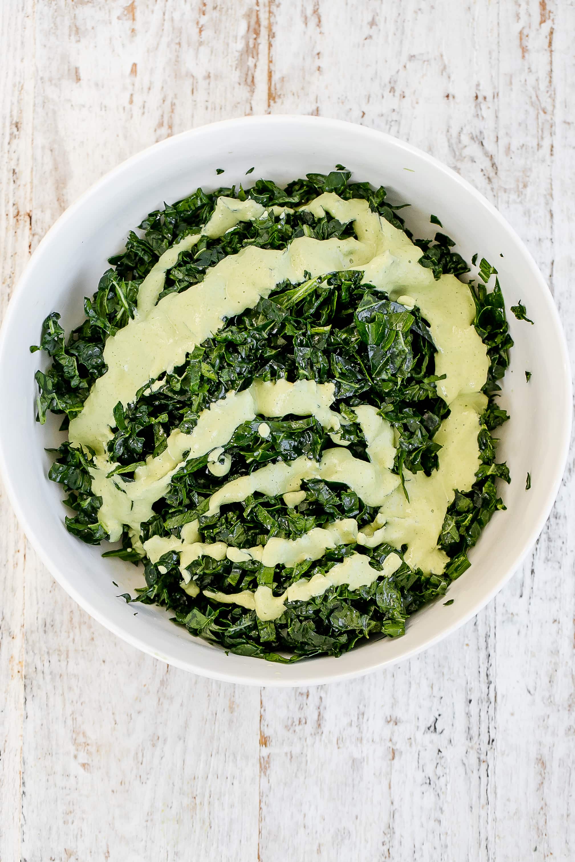 dressing added to kale