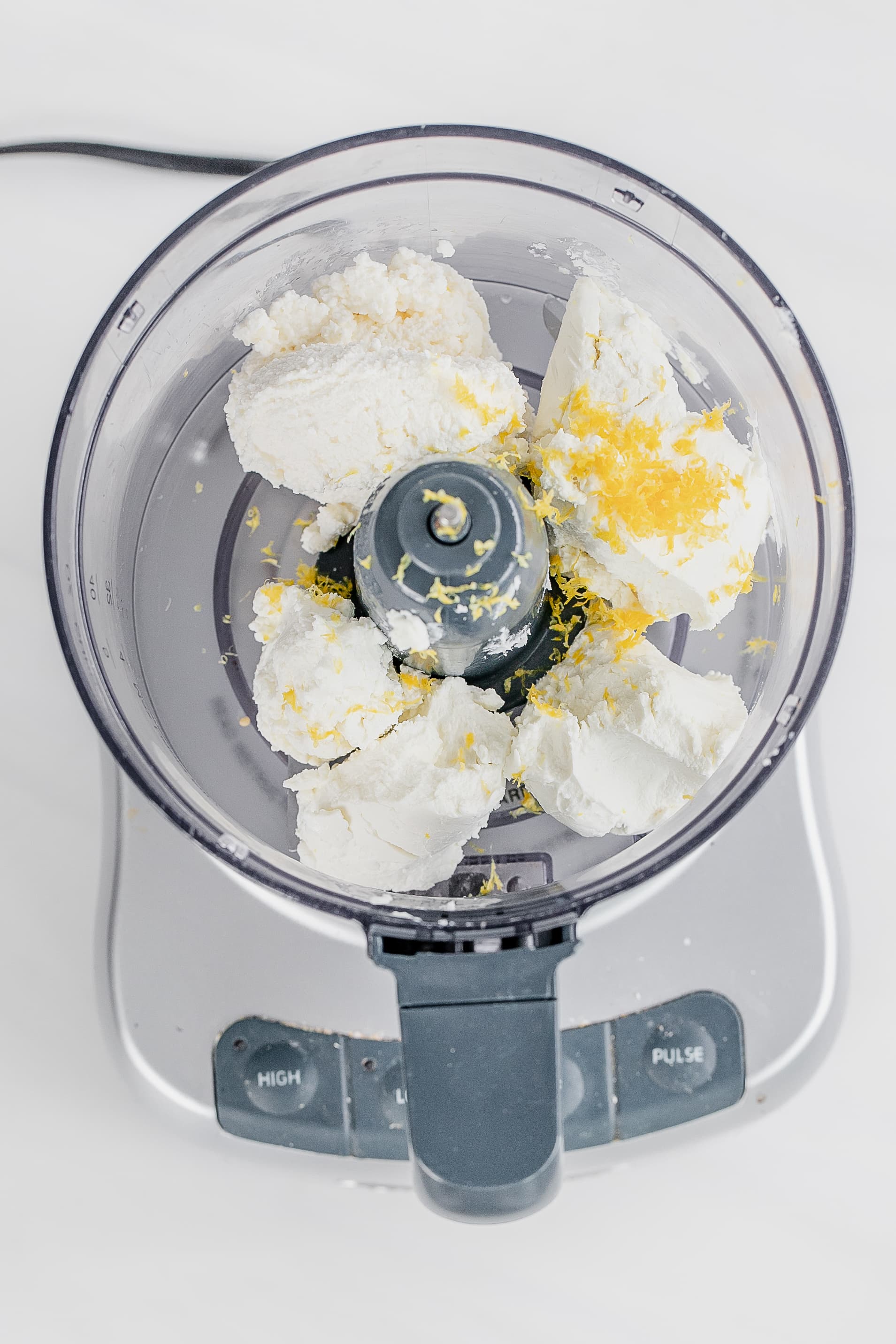 ingredients for whipped goat cheese in food processor