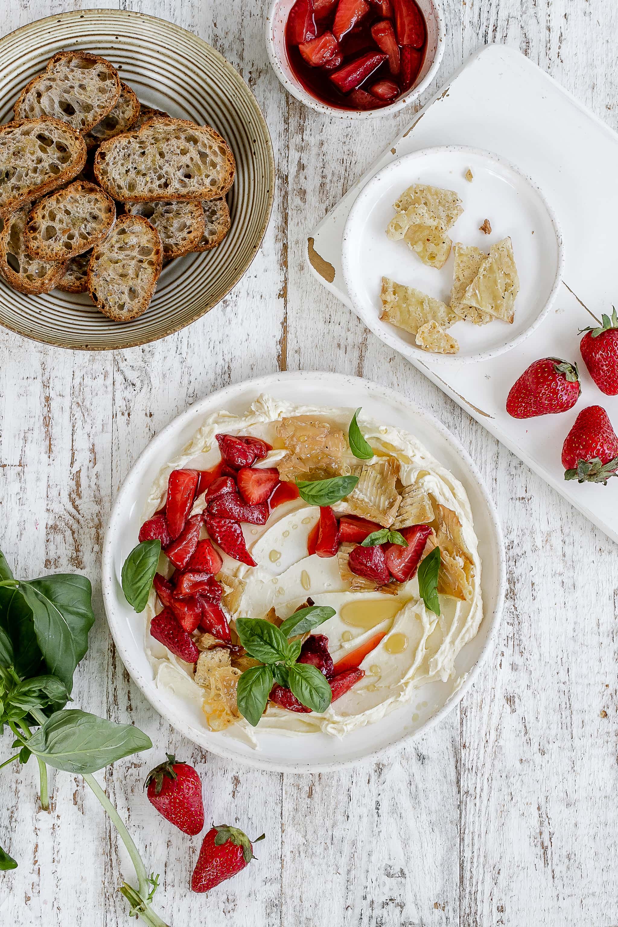 whipped brie on a plate with strawberries.
