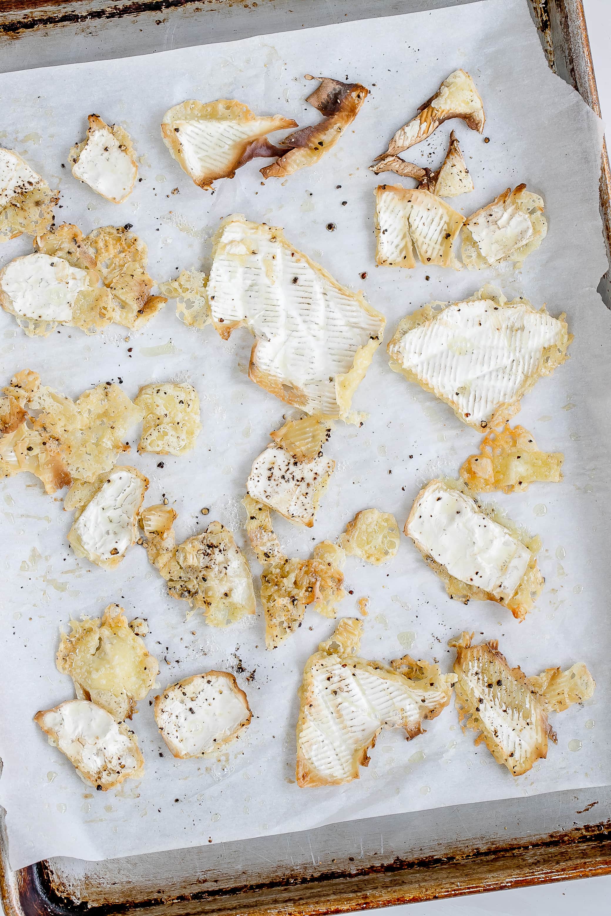 brie rinds on baking sheet out of oven crispy.
