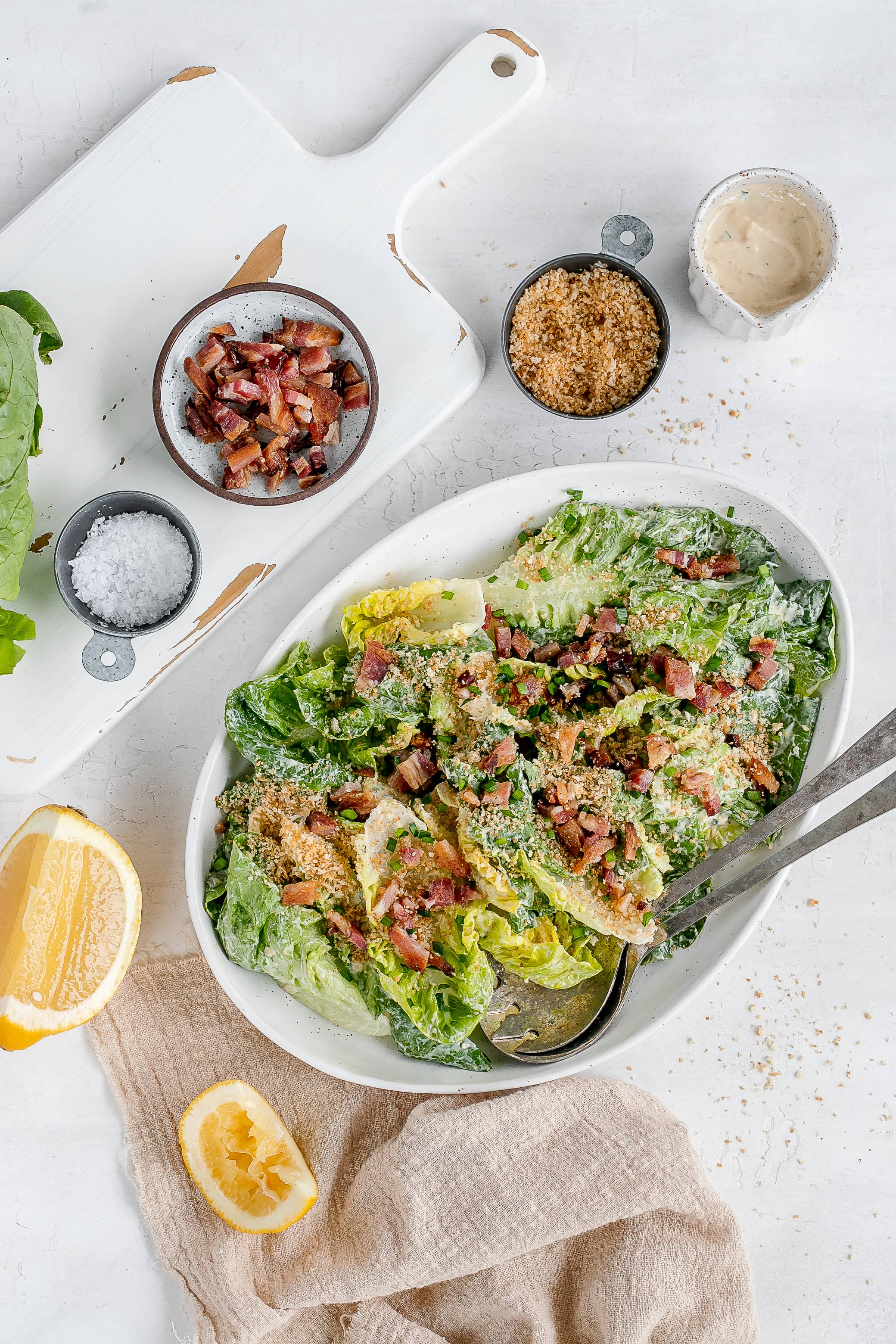 little gem salad with dressing on platter