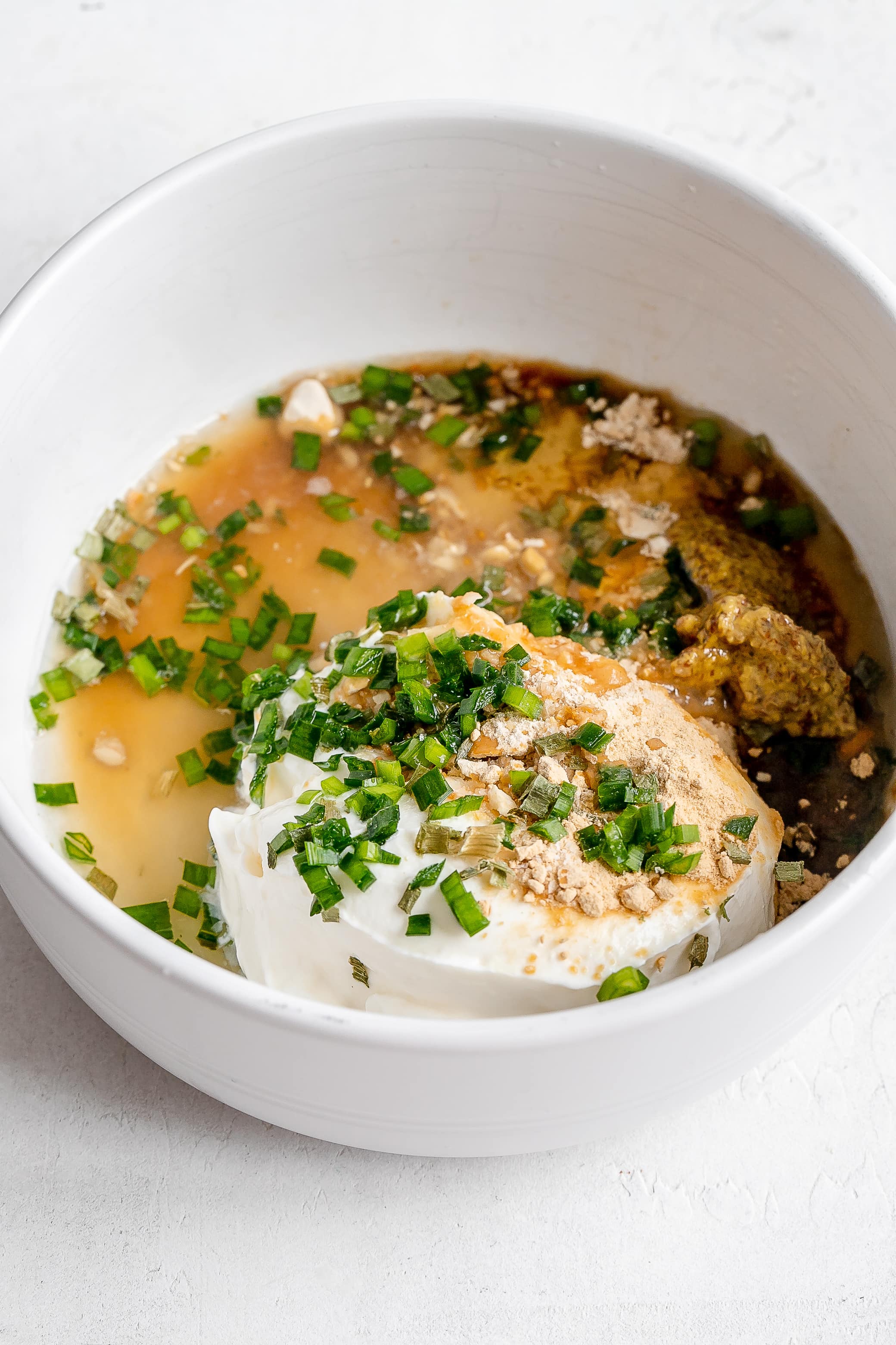 sour cream and onion dressing ingredients in bowl.
