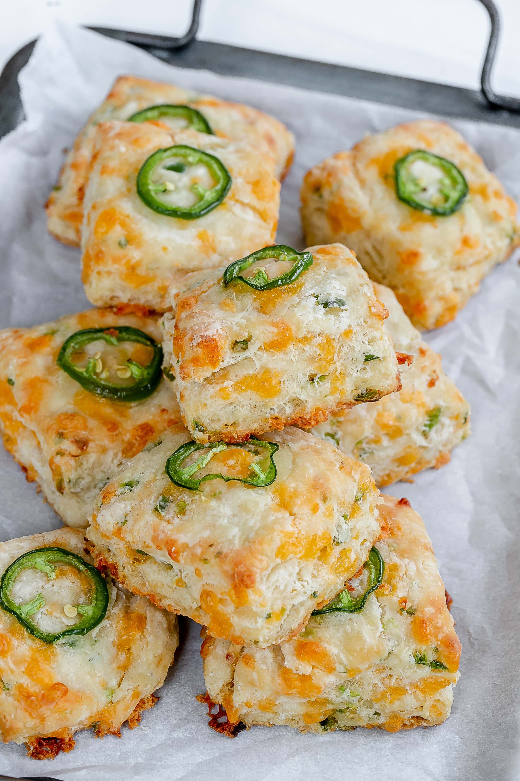 jalapeño cheddar biscuits on baking sheet.