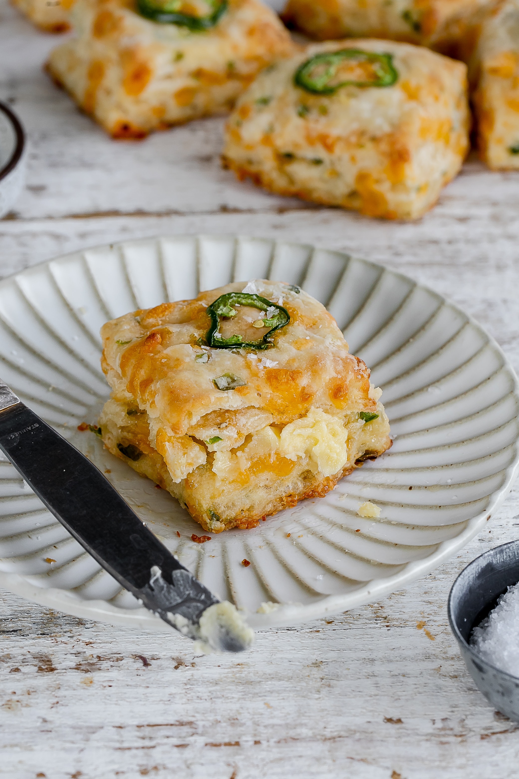 jalapeño cheddar biscuit on a plate.