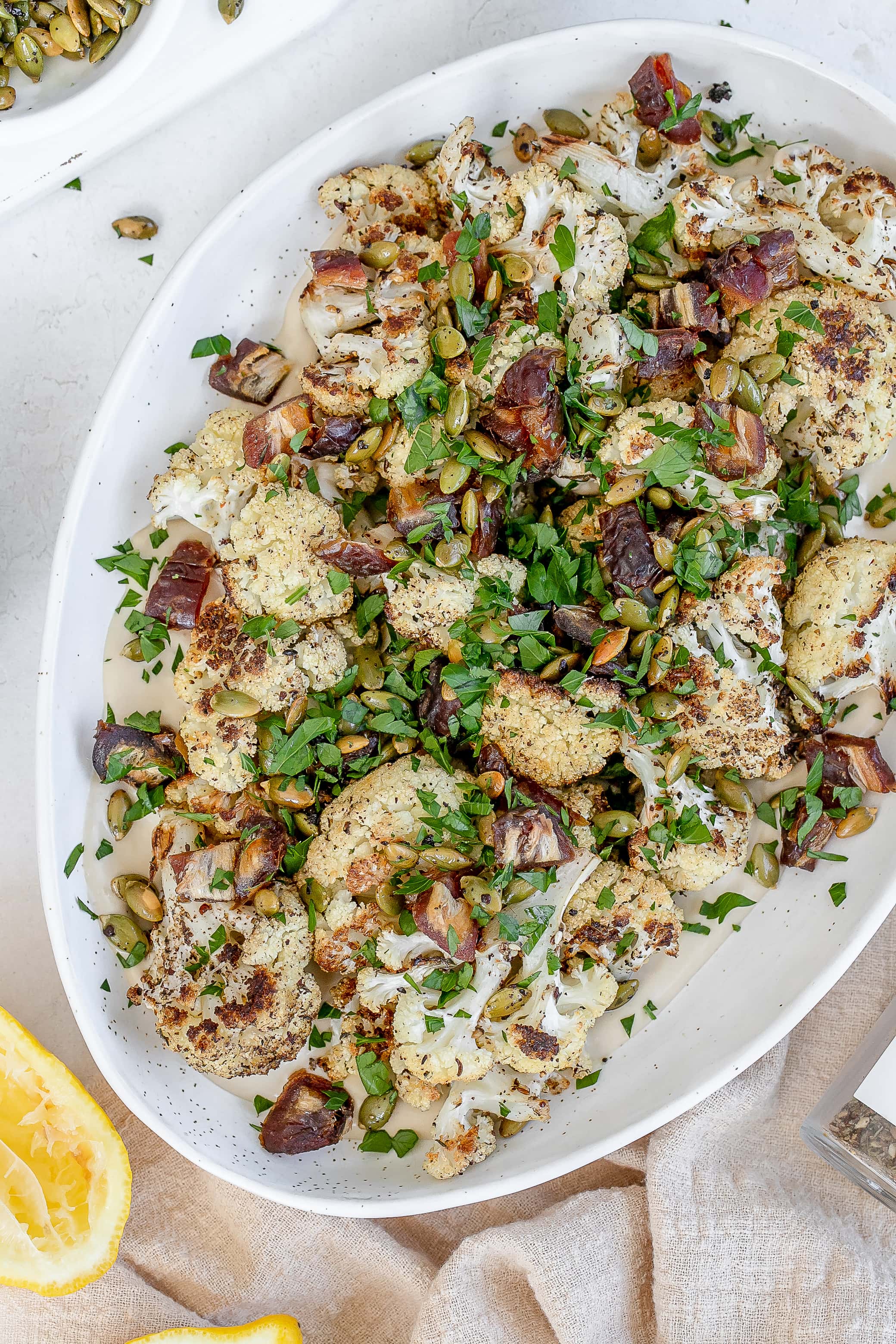 roasted cauliflower with tahini  on a platter. 