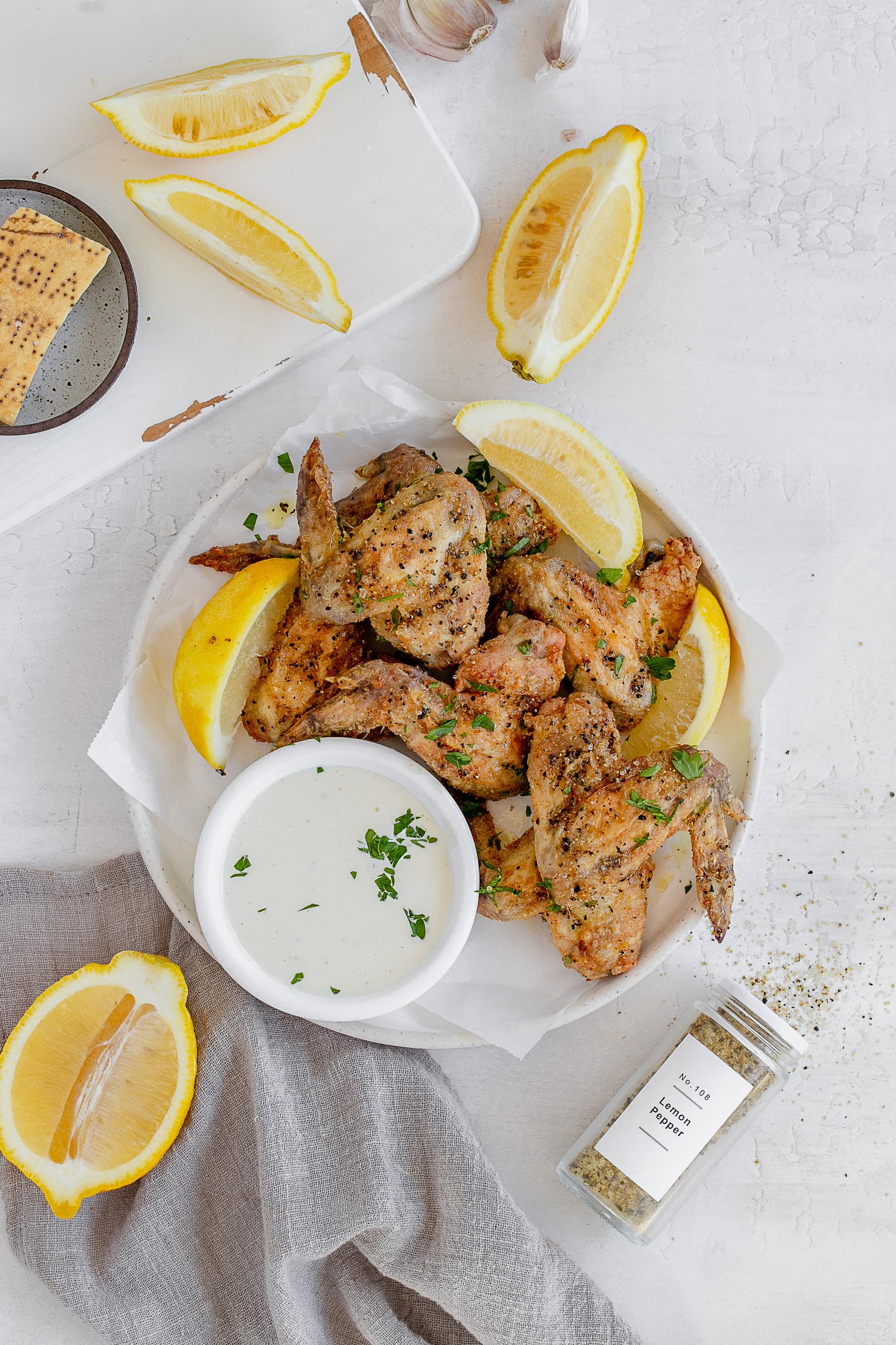 air fryer lemon pepper chicken wings on a plate.