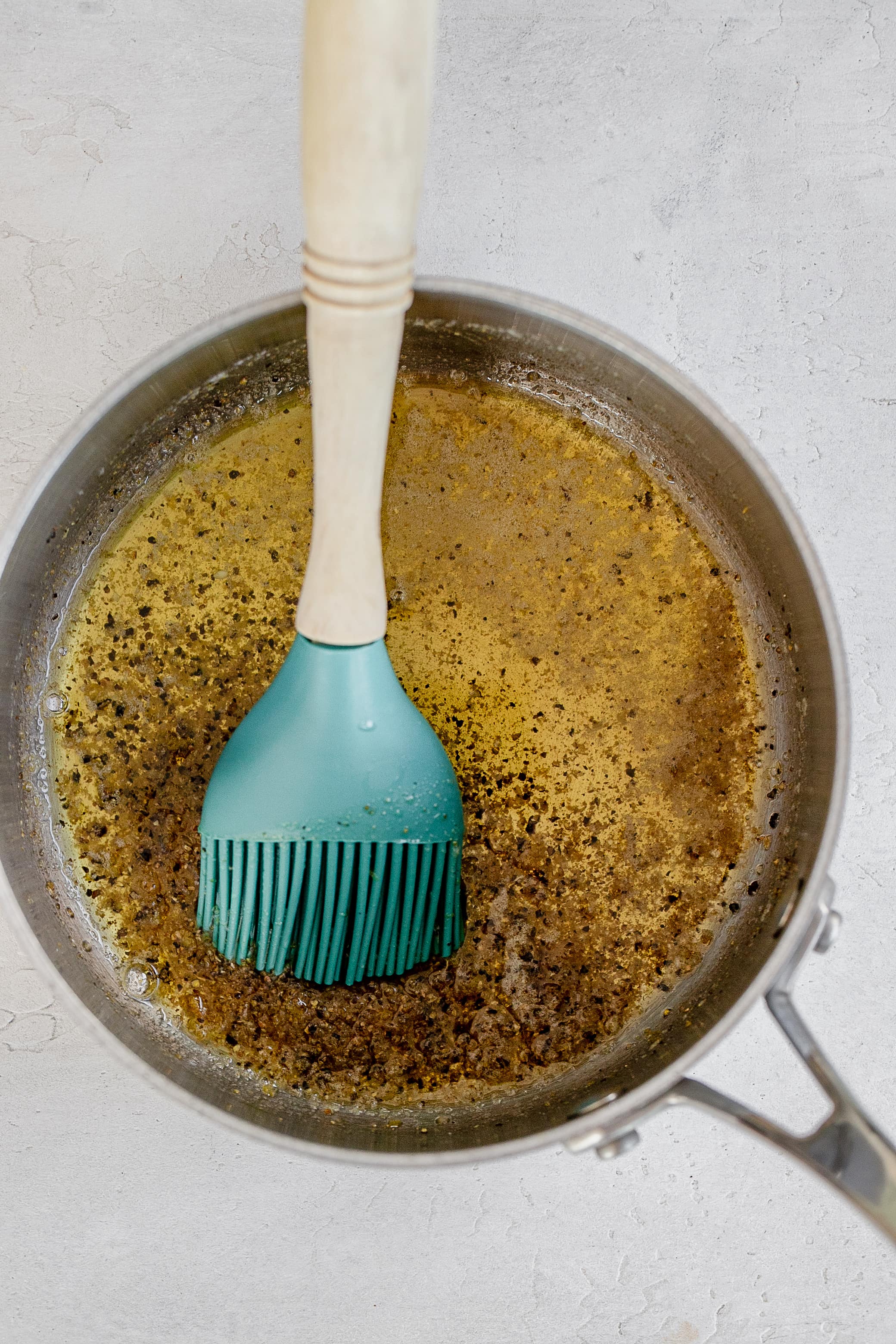 butter melted in pot with lemon pepper seasoning. 