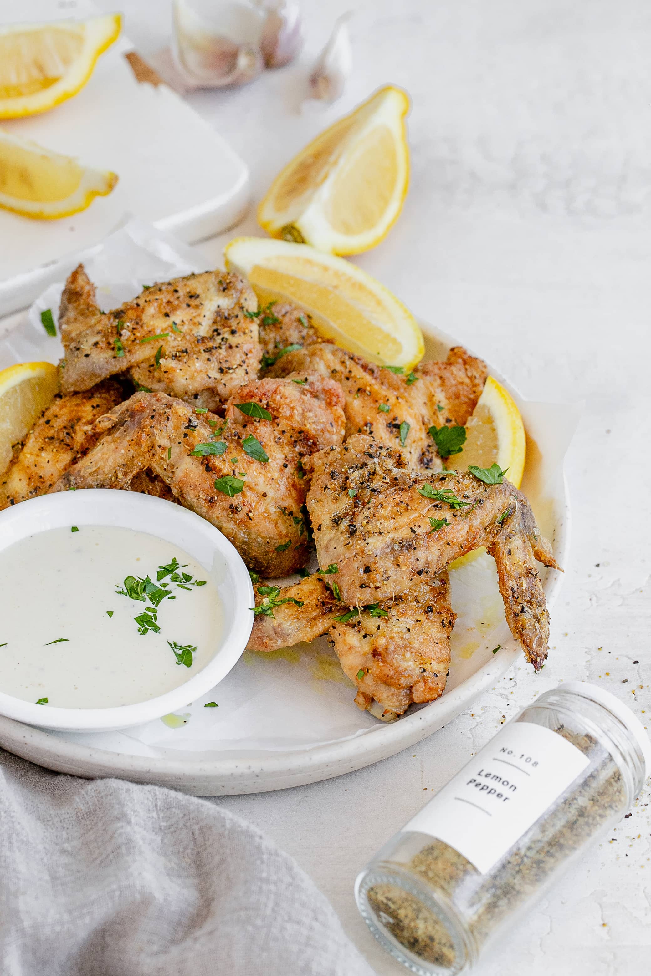 air fryer lemon pepper chicken wings on a plate.