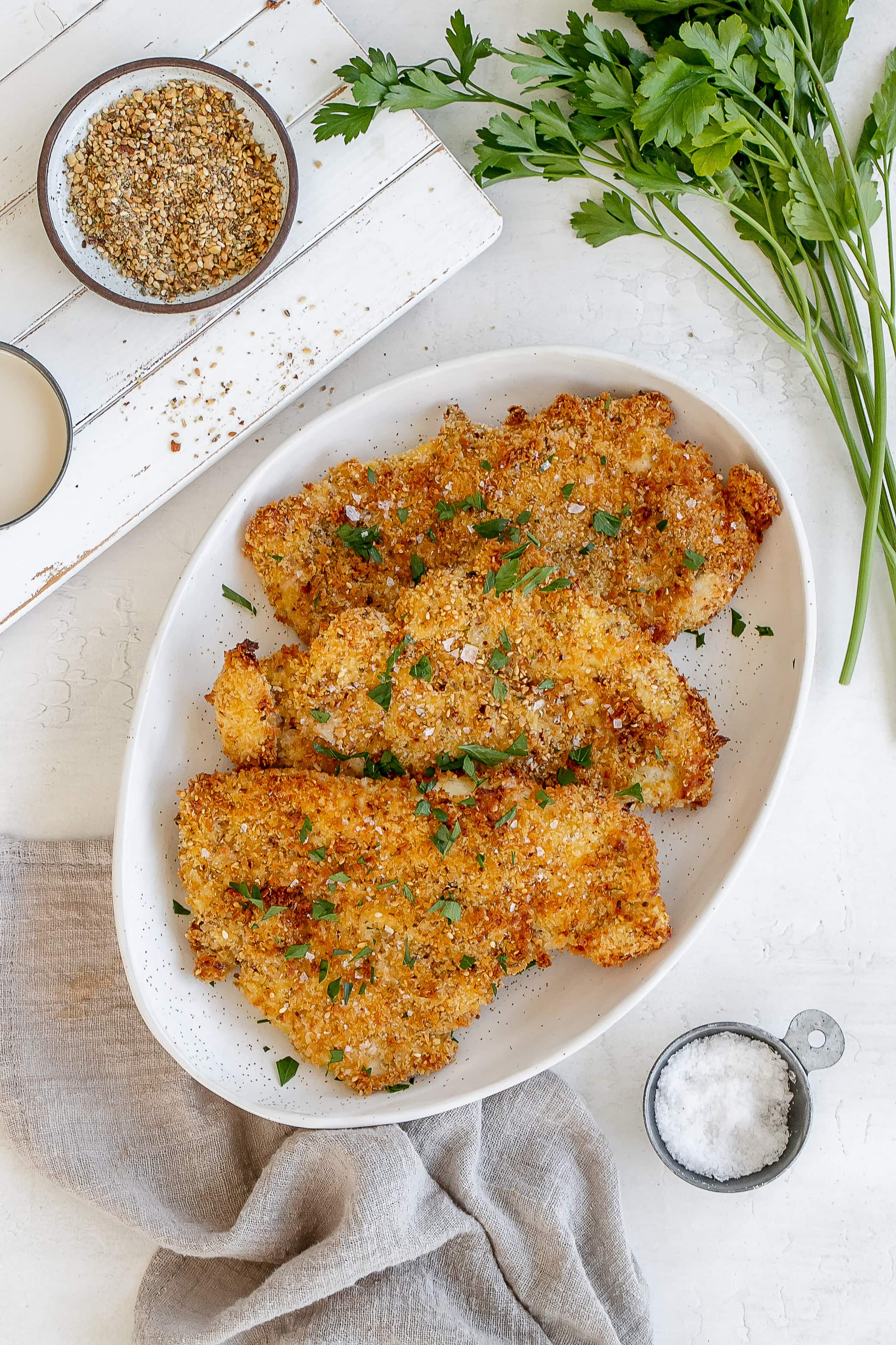 air fryer chicken schnitzel on a platter.