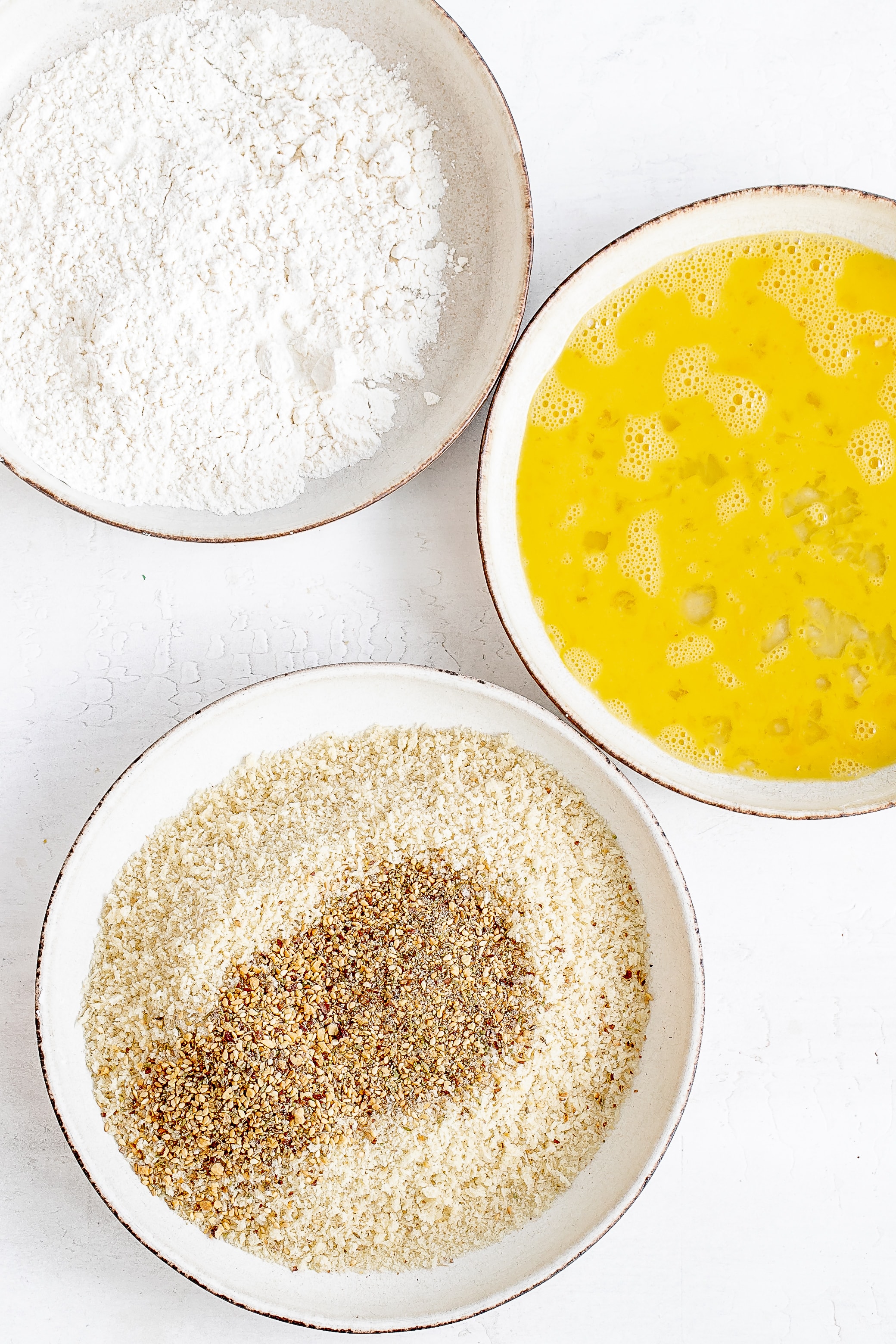 flour, egg and panko mixture in bowls.