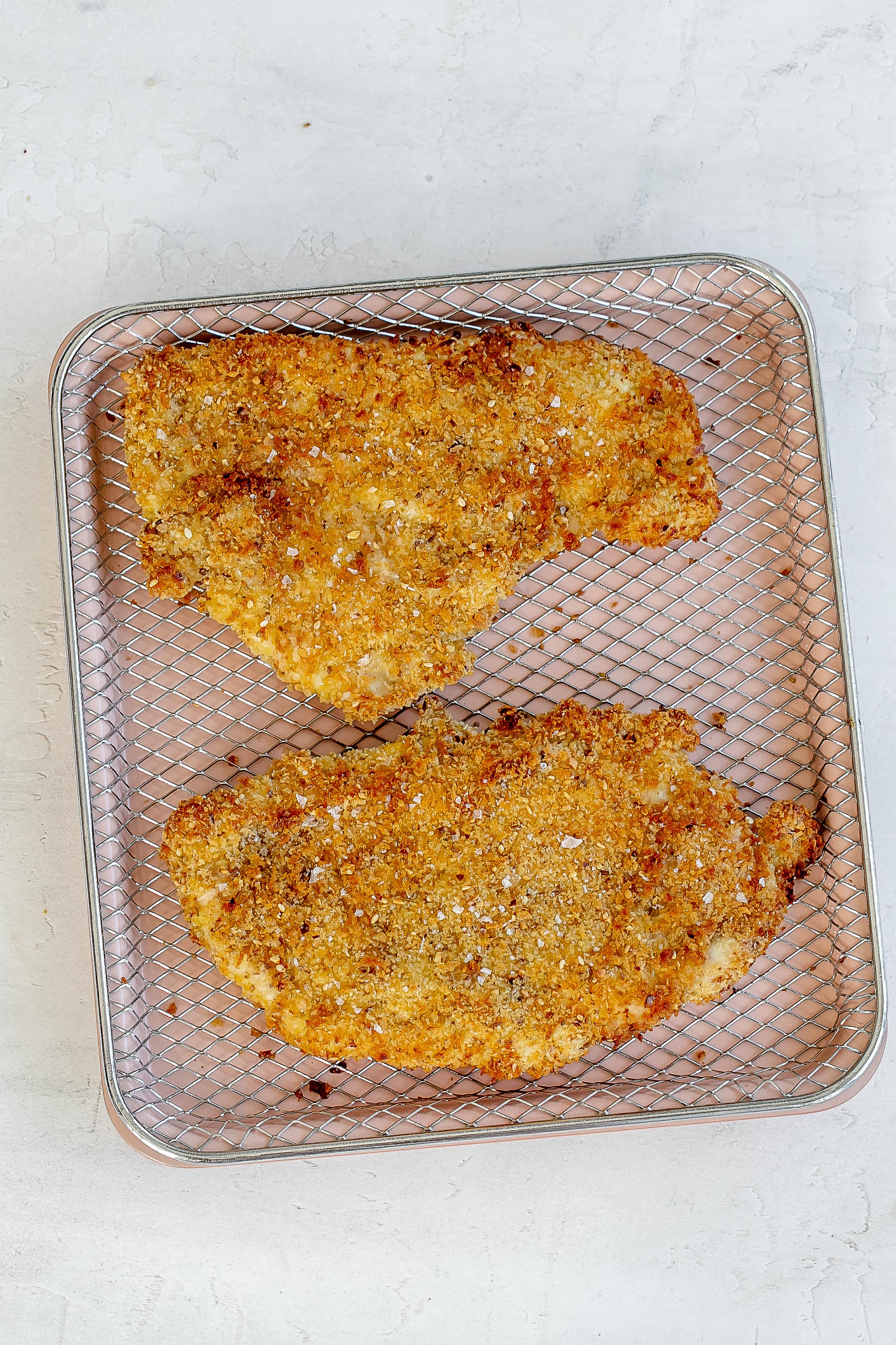 chicken schnitzel on tray.
