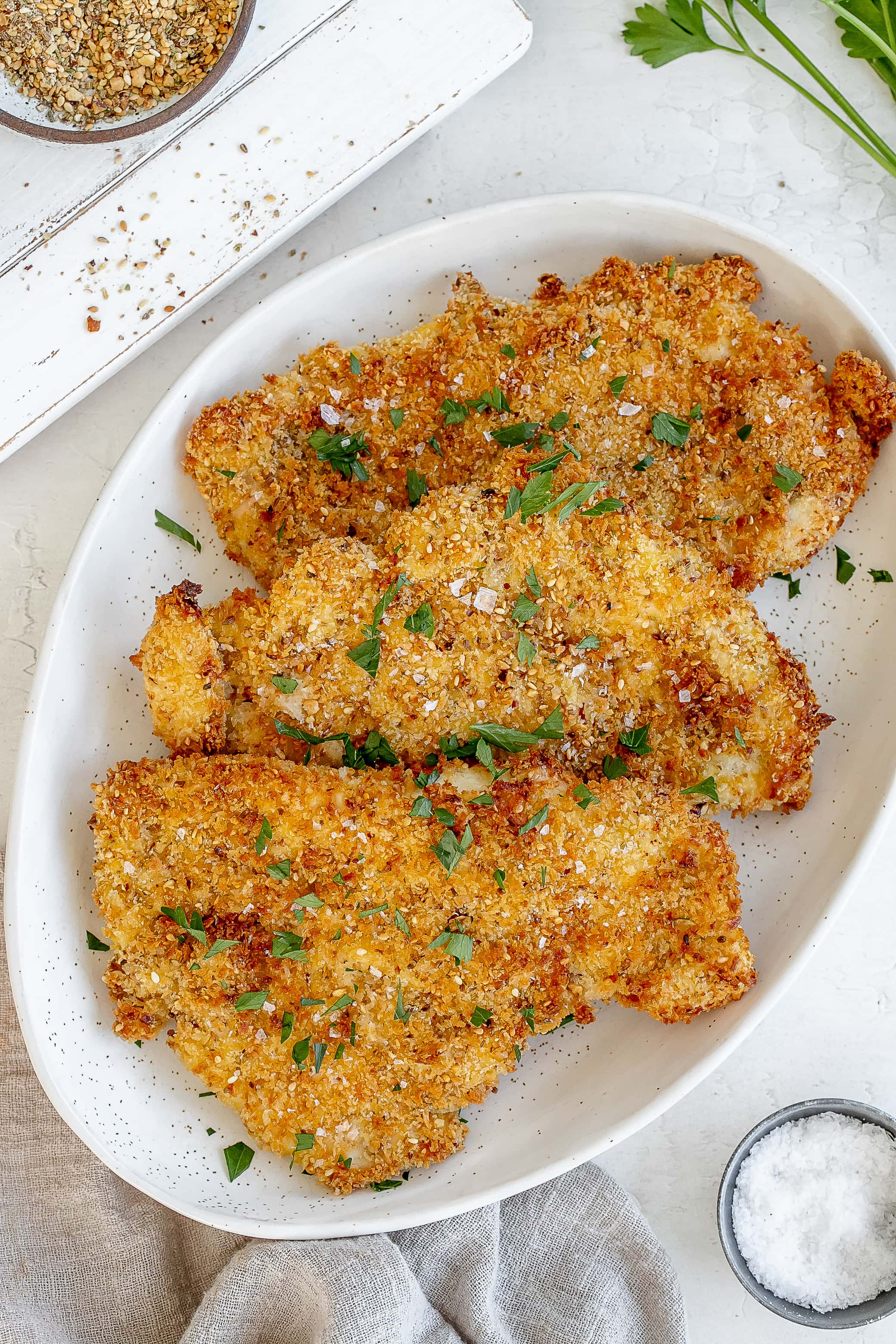 air fryer chicken schnitzel on a platter.