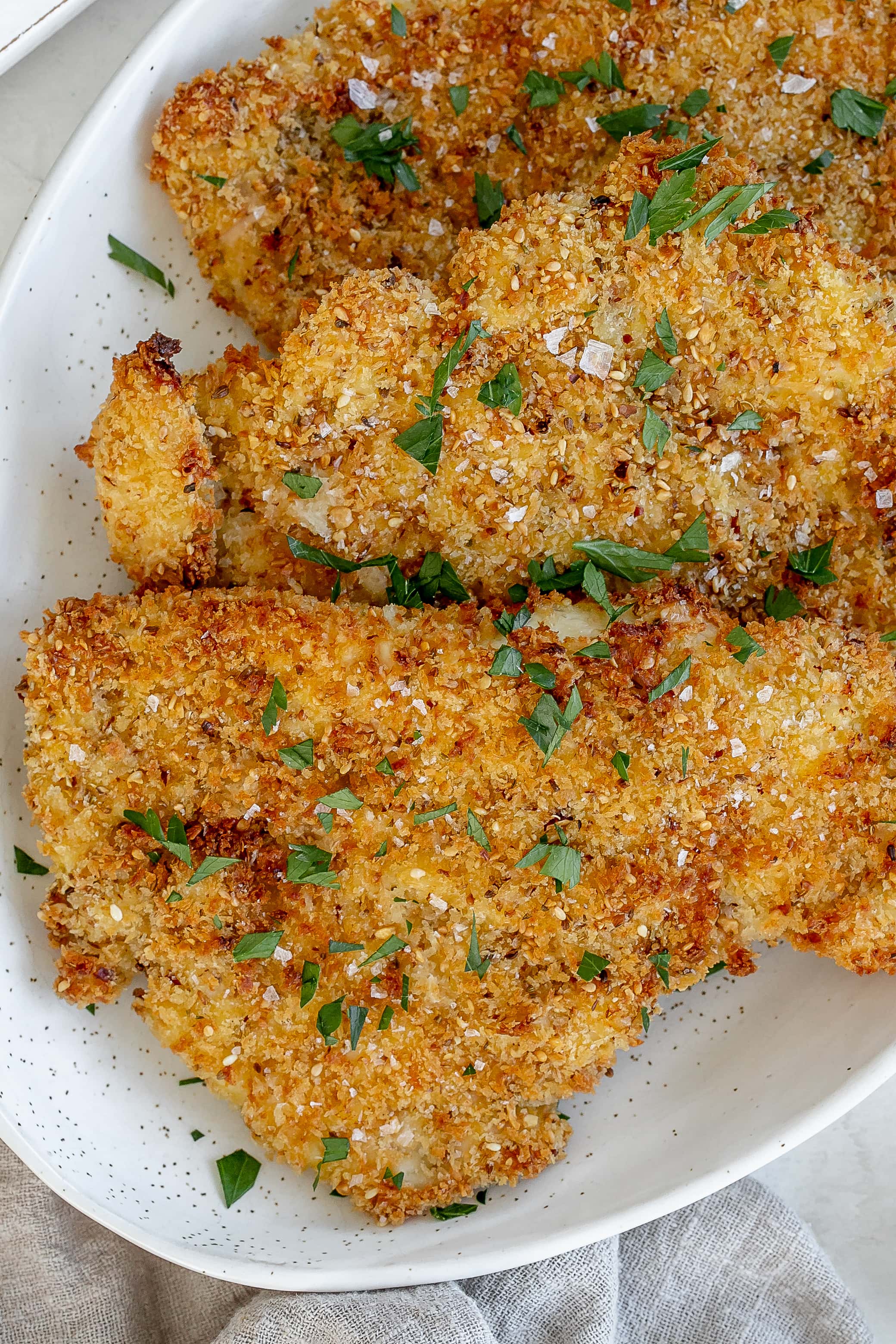 air fryer chicken schnitzel on a platter.