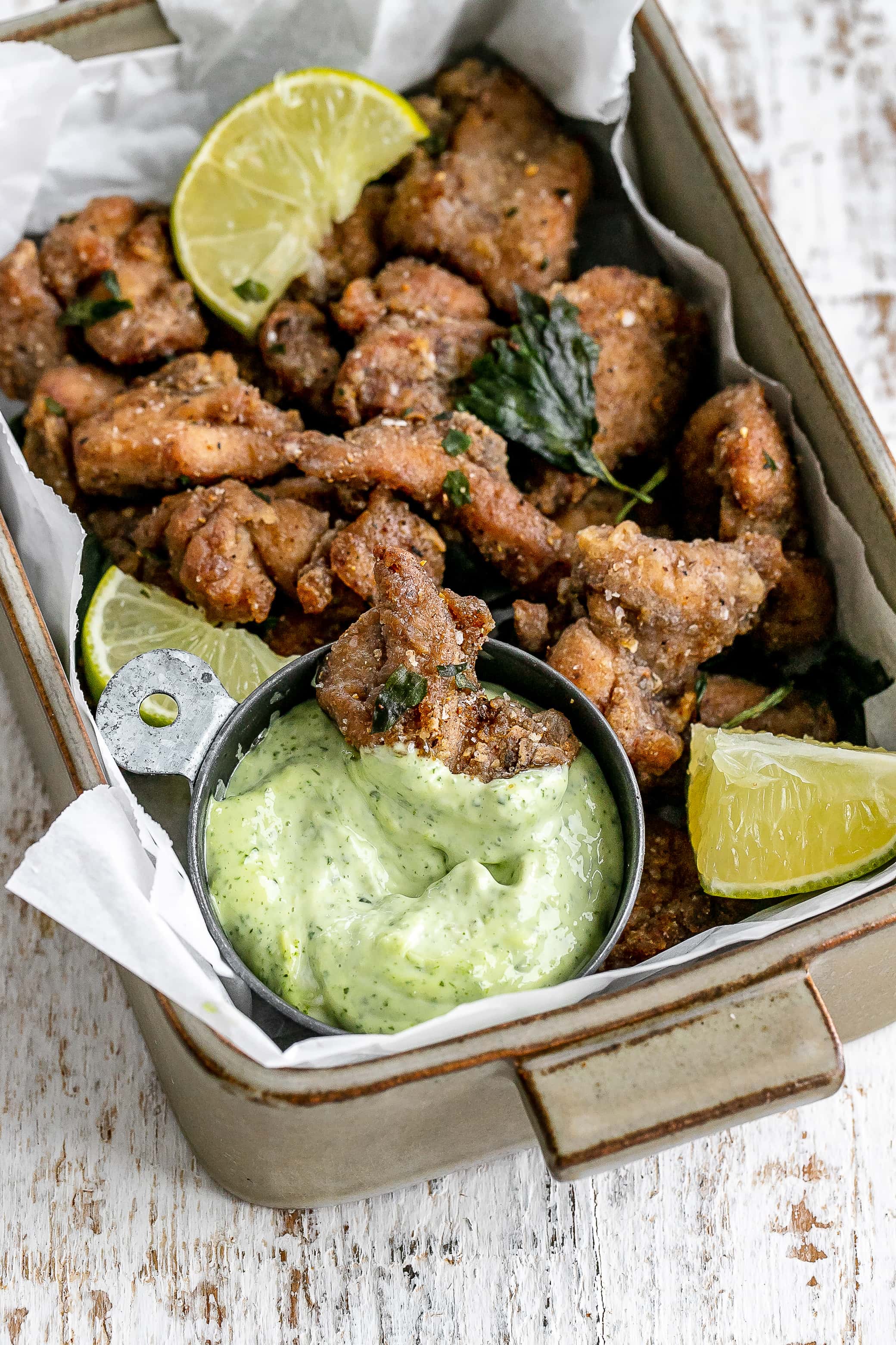Taiwanese popcorn chicken in a serving dish with a dip.