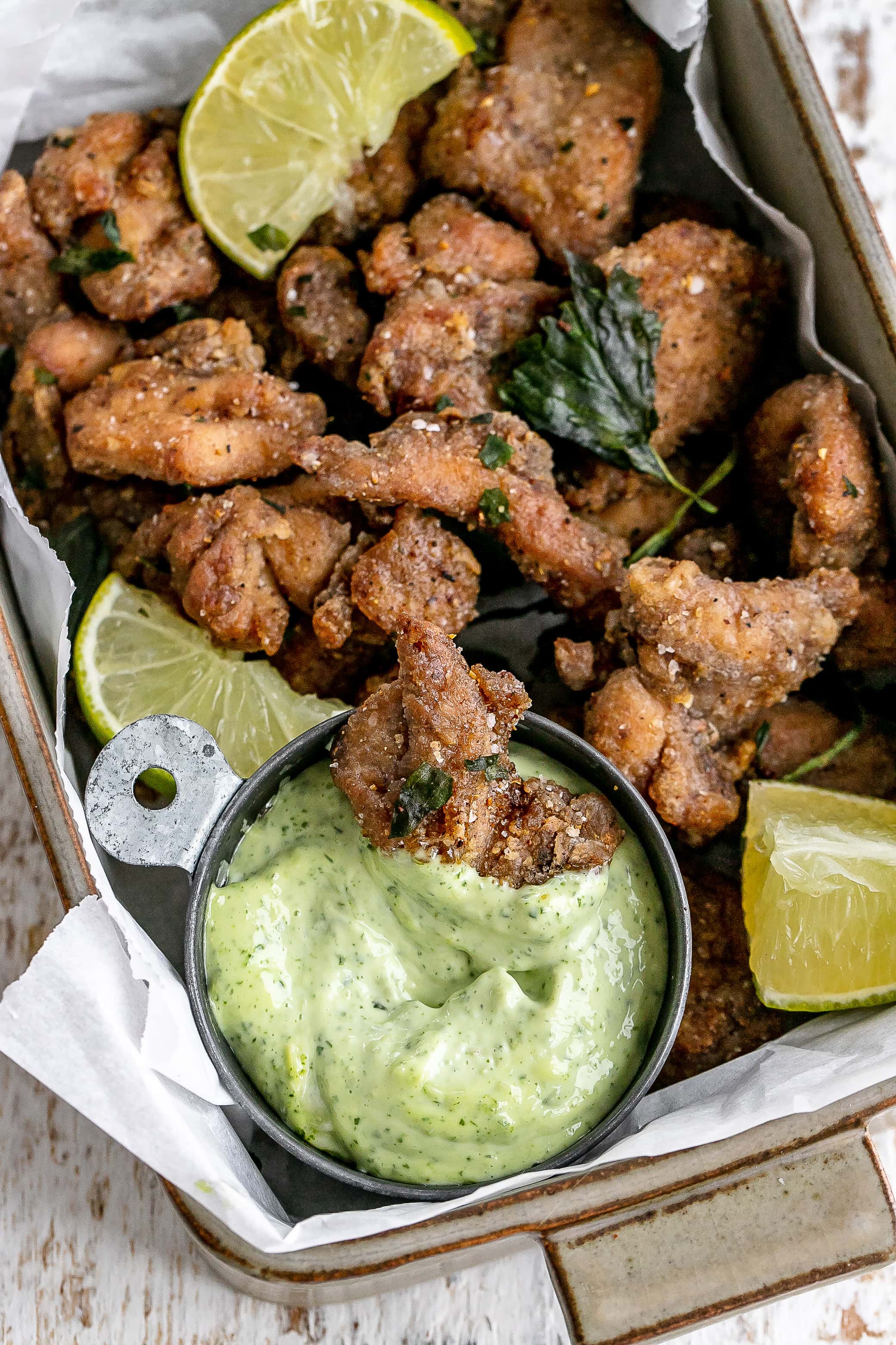 Taiwanese popcorn chicken in a serving dish with a dip.