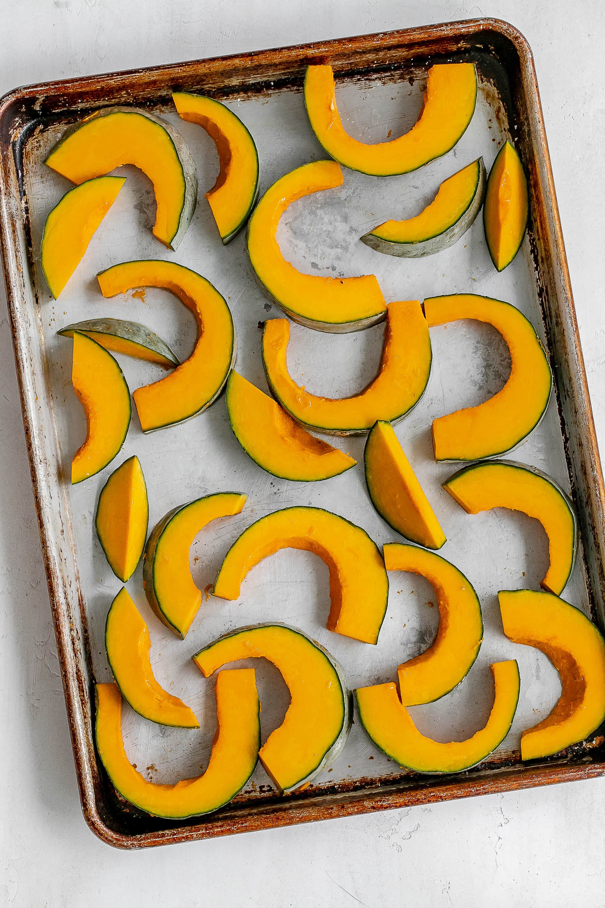 kabocha squash on baking sheet.