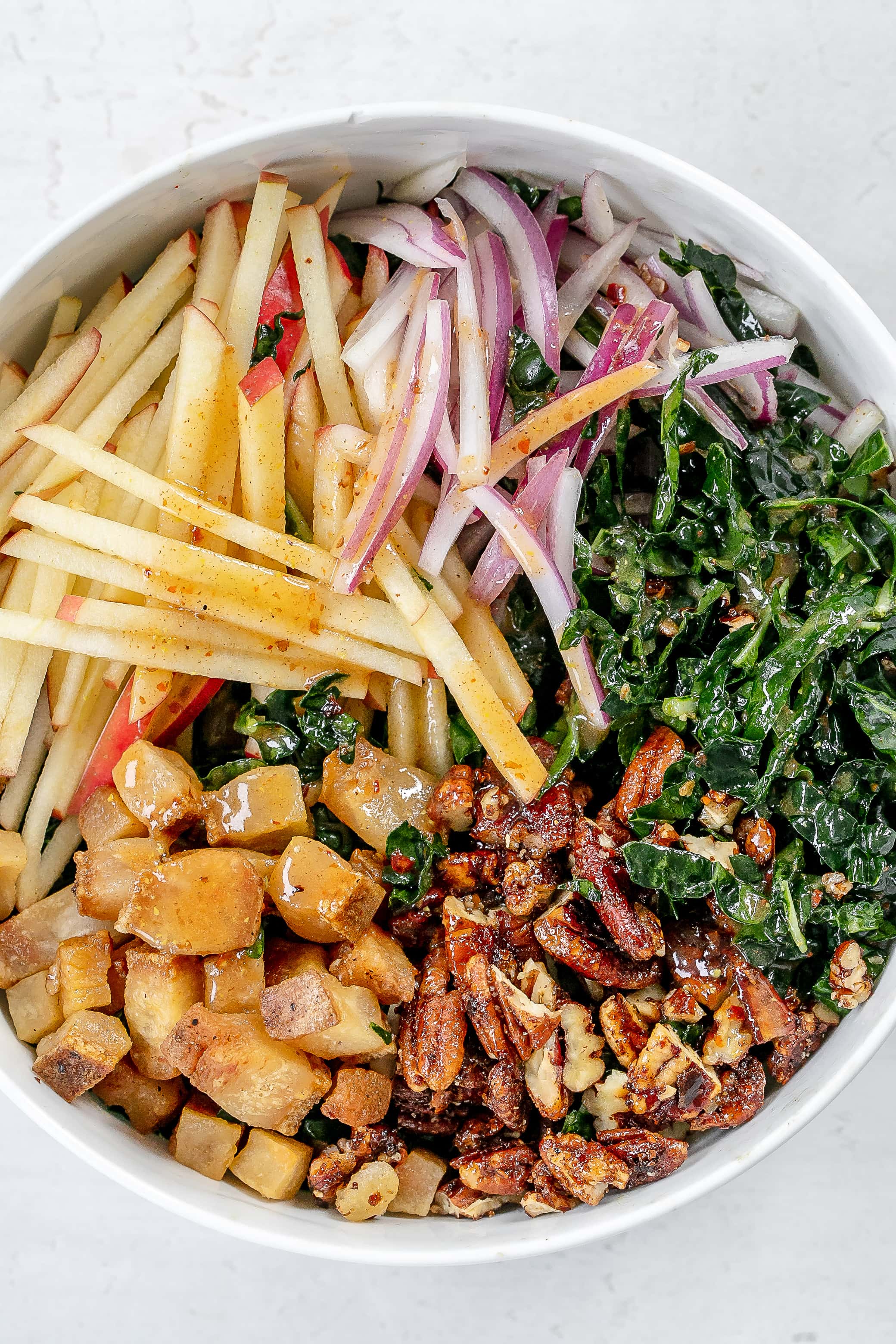 other ingredients added to kale in bowl. 