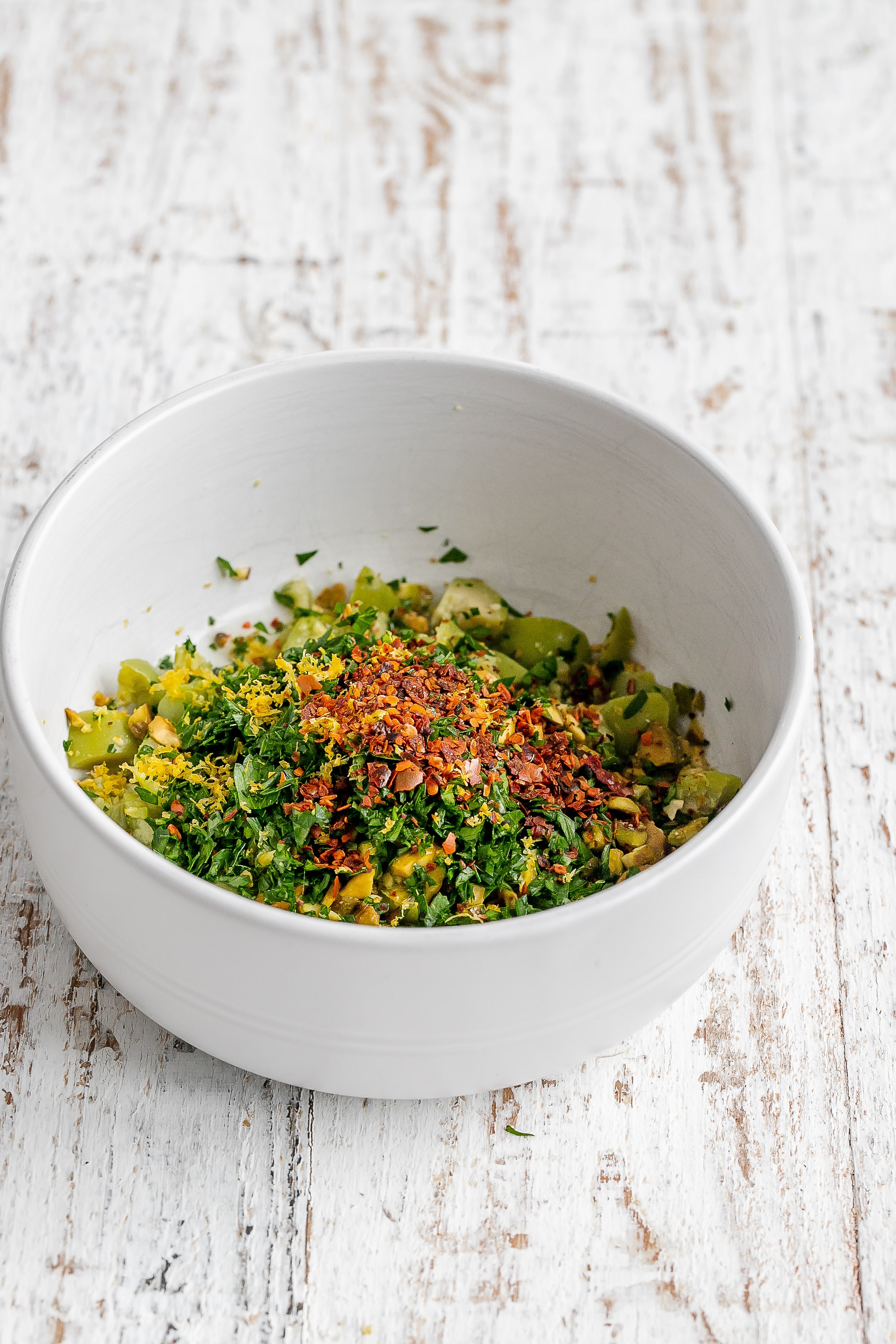 ingredients for tapenade in bowl.