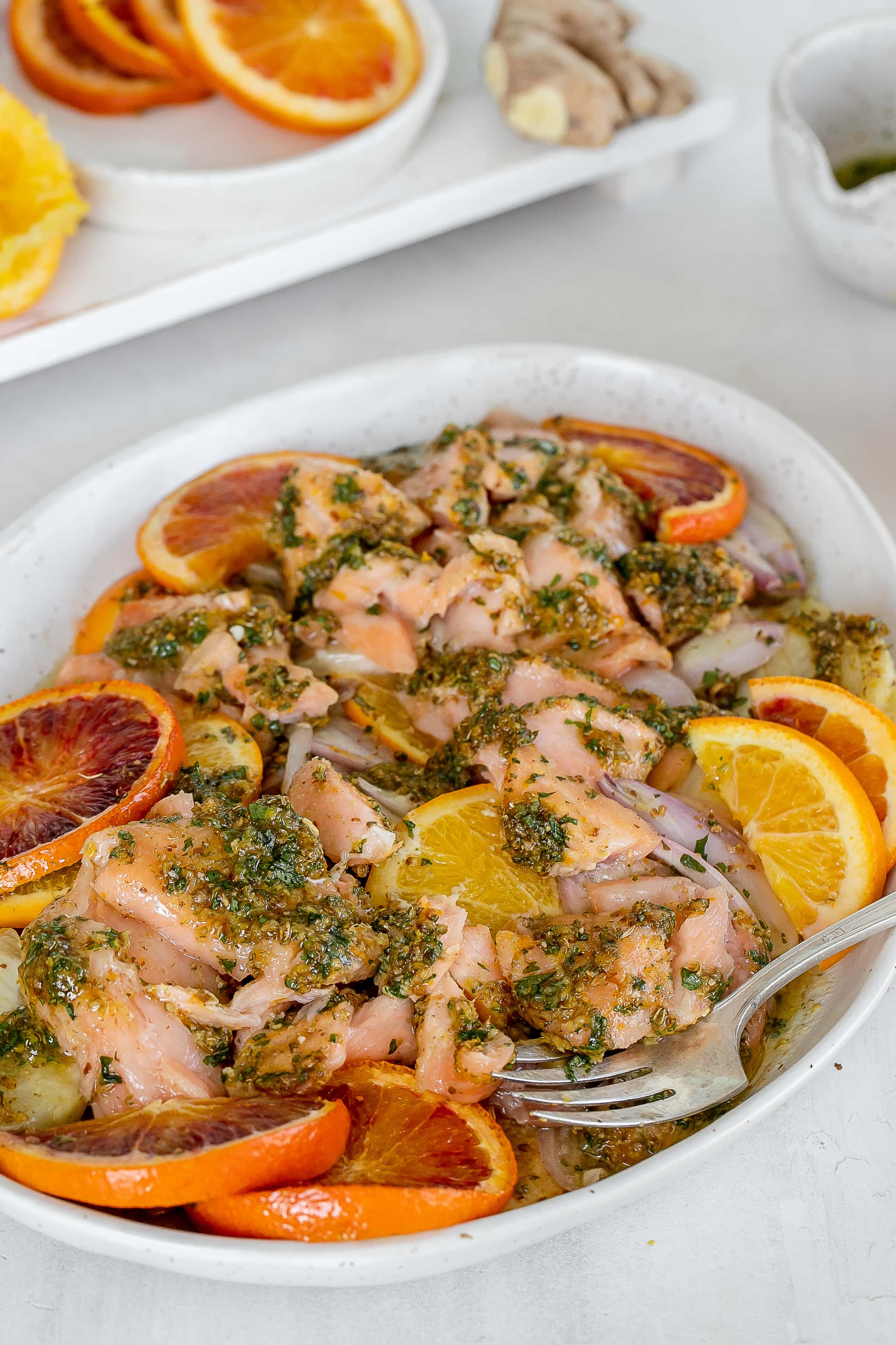salmon with citrus on a platter with fennel.