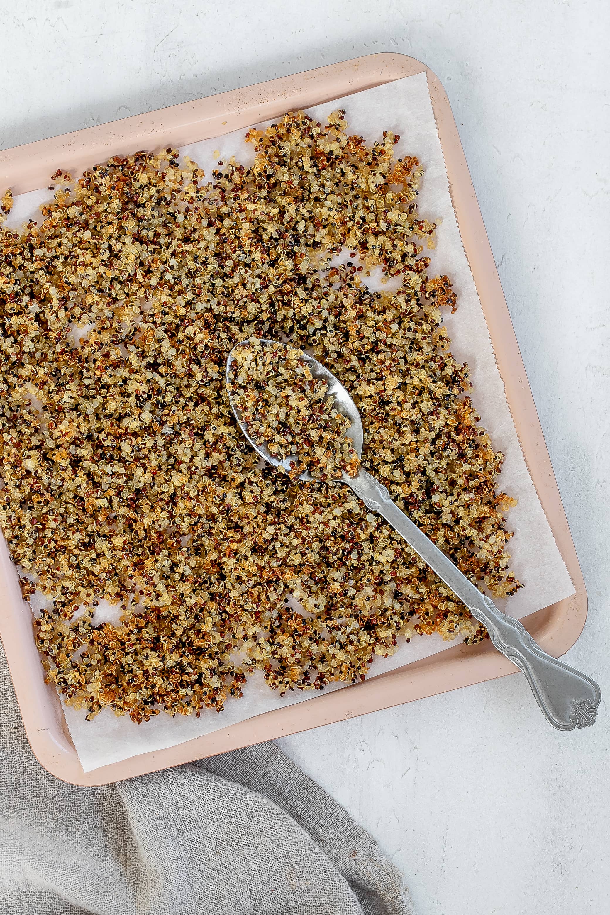 crispy quinoa on air fryer baking tray.